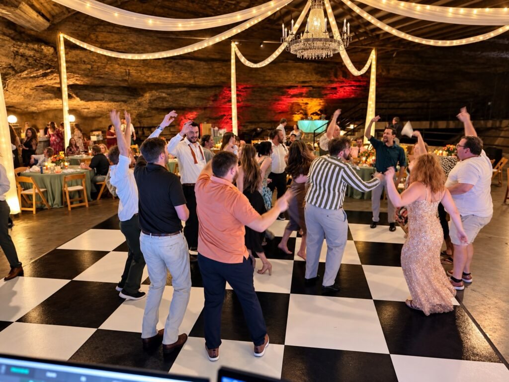 Bowling Green Kentucky Wedding DJ 3 Guests dancing on the checkered dance floor at a Lost River Cave wedding in Bowling Green, Kentucky